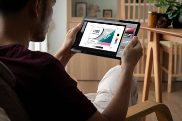 Graphic designer software for modern design of web page and commercial ads showing on the computer screen