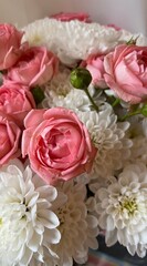 A beautiful bouquet of white asters and pink roses