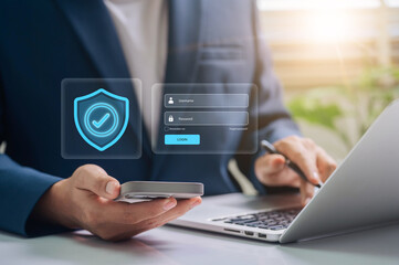 data protection and cybersecurity. Secure Login Authentication, Business professional using smartphone and laptop for secure login authentication, password field and shield icon for data protection.