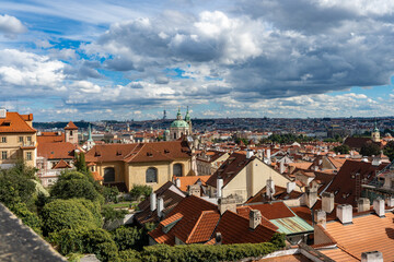 Prague, Czech Republic amazing panoramic from above viewpoint. Beautiful roofs buildings houses towers churches at autumn sunny day. World heritage city. 