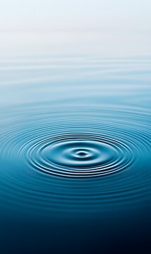 22. A peaceful blue water texture displaying gentle rings and ripples, captured from a flat lay perspective, creating a harmonious spa background with clear space for text