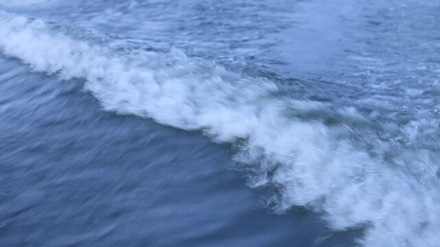 Wave from motorboat engine after stern on sea water