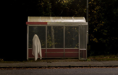 Halloween night with ghost at bus station © Andrew An