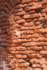 The old brick wall vertical background with grunge texture on surface, side view