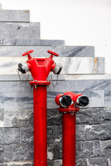Red fire hydrant mounted on the wall