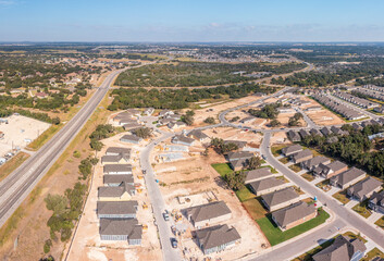 Aerial drone view of new homes under construction near Georgetown, Texas for senior adults
