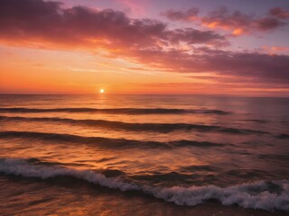 Obraz premium A vibrant sunset casting golden light over the ocean, with orange and pink tones reflecting on the calm waves and a clear sky above 