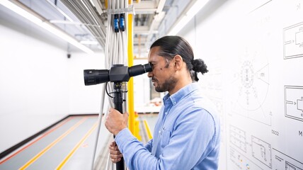 A close-up of an engineer inspecting fiber optic cables with a fiber scope, checking for any imperfections before high-speed internet deployment.