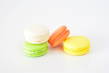 colorful macarons are next to each other on white background
