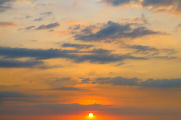 Sunrise sky with lighted clouds.