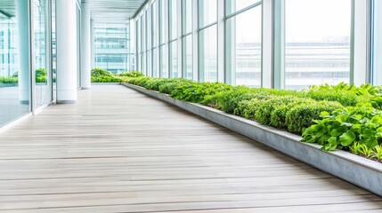 Obraz premium Modern indoor walkway lined with plants, offering panoramic views of a city skyline through large glass windows. Urban greenery concept.