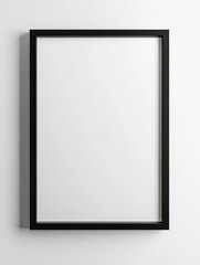 An empty black frame stands against a stark white wall, inviting the imagination to fill its void with creativity.