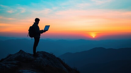 Working Remotely in Vacation, traveler stands on a mountain peak working on laptop in hand, gazing at a breathtaking landscape. Adventure awaits