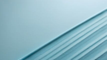 Obraz premium Soft Blue Fabric Draped Elegantly on a Neutral Background During a Serene Afternoon Light Setting