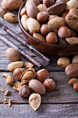 Variety of nuts with shells in a bowl