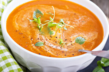 Tomato soup in white bowl