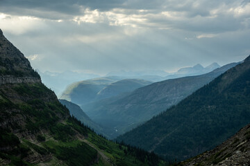 Fototapeta premium Subtle Rays Through Clouds Over Logan Pass