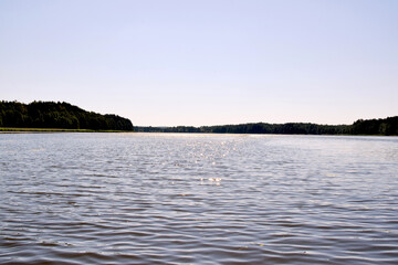 Water surface of a forest lake in the summer morning