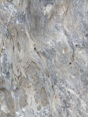 stone wall texture. Uneven texture of gray stone with white streaks