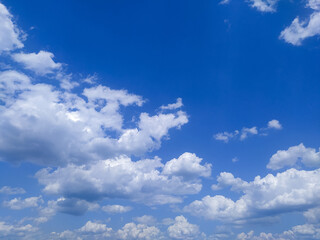 Blue sky with clouds. Cumulus clouds, blue sky, summer. Beautiful blue sky with soft white clouds. Abstract background of nature