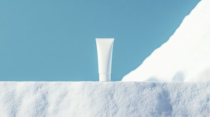 A sleek cosmetic tube displayed against a snowy backdrop, symbolizing purity and freshness in skincare.