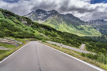 Naklejka premium Curvy pass road San Bernadino Pass, with clouds, canton of Grisons, Switzerland, Europe