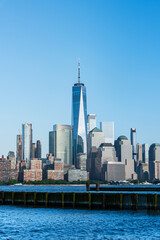 View of the Manhattan skyline from Hoboken, New Jersey, set against a clear blue sky. 