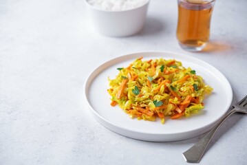 Cabbage and carrots thoran in a bowl