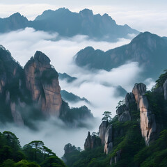 A misty mountain landscape with towering, rocky peaks and lush green foliage