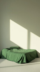 green bed in bedroom, bed with pillows, a bed with green linen sheets in an empty room