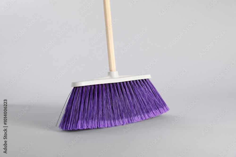 Canvas Prints One bright cleaning broom on grey background