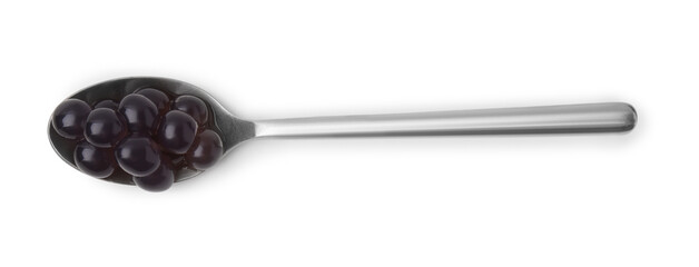 Dark tapioca pearls in spoon isolated on white, top view