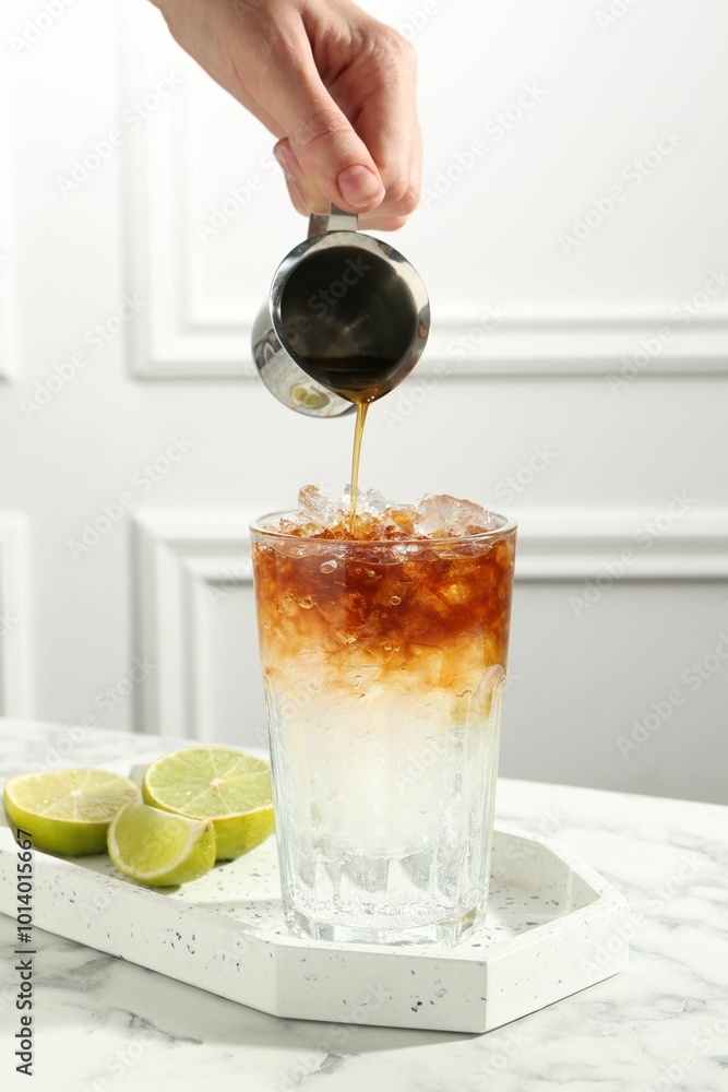 Poster Woman making refreshing espresso tonic drink at white marble table, closeup