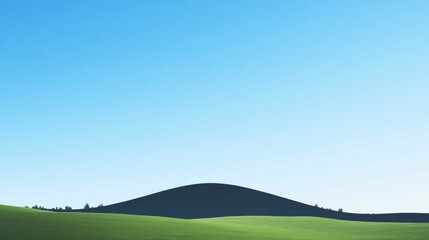 Fototapeta premium a deep blue sky and black mountain silhouettes against a blue and white gradient background. The image captures a dark green hill shape at the center, with a shadowy foreground, evoking an atmosphere 