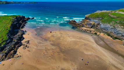 Aerial View of a Scenic Sandy Beach at Porth Beach, Cornwall, UK