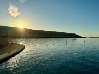 sunset over the sea in the harbour