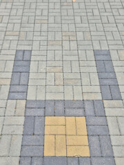 Creative geometric patterns on a modern pavement. Unique tile arrangement adds visual interest to urban landscapes.