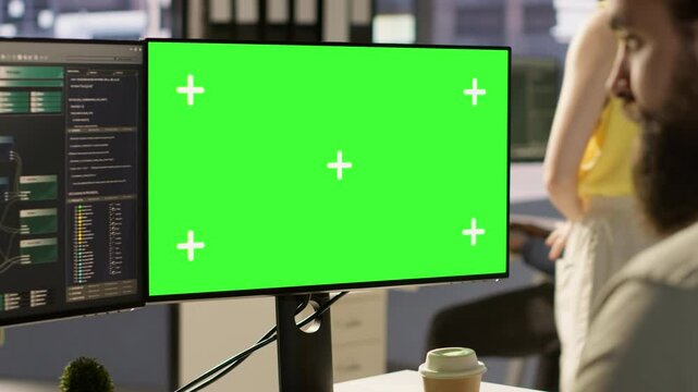 Man working with machine learning tech on green screen computer, advancing AI innovating autonomous systems, close up. Zoom in on mockup PC monitor used by IT expert in office, camera A