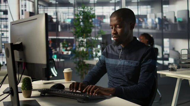 Portrait of happy programmer working with machine learning artificial intelligence critical to autonomous systems. Upbeat software engineer transforming data into predictive models, camera B