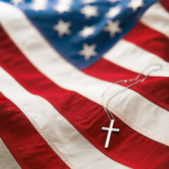 Christian cross necklace on American flag. For US Memorial Day, Veterans Day, USA memorial or...
