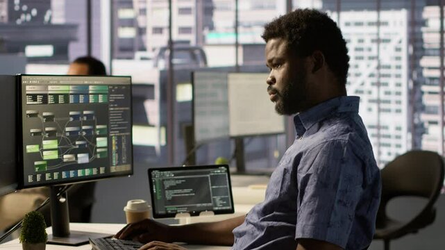 Developer working together with helpful colleague on artificial intelligence machine learning tech, improving company systems. IT specialist assisted by coworker to compare data