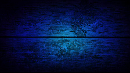 A deep blue and black gradient over natural wood grain texture, offering a moody, rustic background perfect for banners, designs, or atmospheric decor projects
