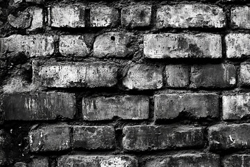 Texture of a brick wall, in black and white tones