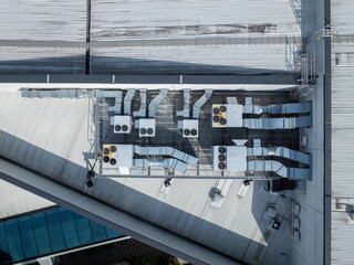 Aerial: Top down shot of Air Conditioning And Ventilation Systems Installed On The Roof