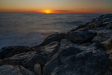 An atmospheric view of the sea, where the waves are washed away