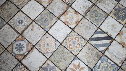 old vintage square tiles with various patterns