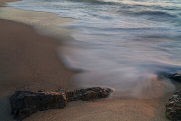 An atmospheric view of the sea, where the waves are washed away