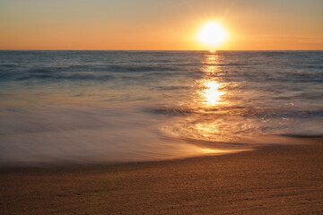 An atmospheric view of the sea, where the waves are washed away