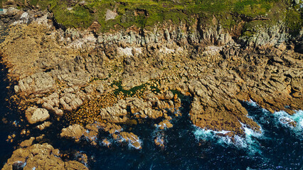 Aerial View of Rocky Coastline and Blue Ocean in Cornwall, UK