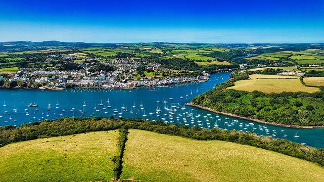 Aerial View of a Coastal Town with Sailboats in Cornwall, UK